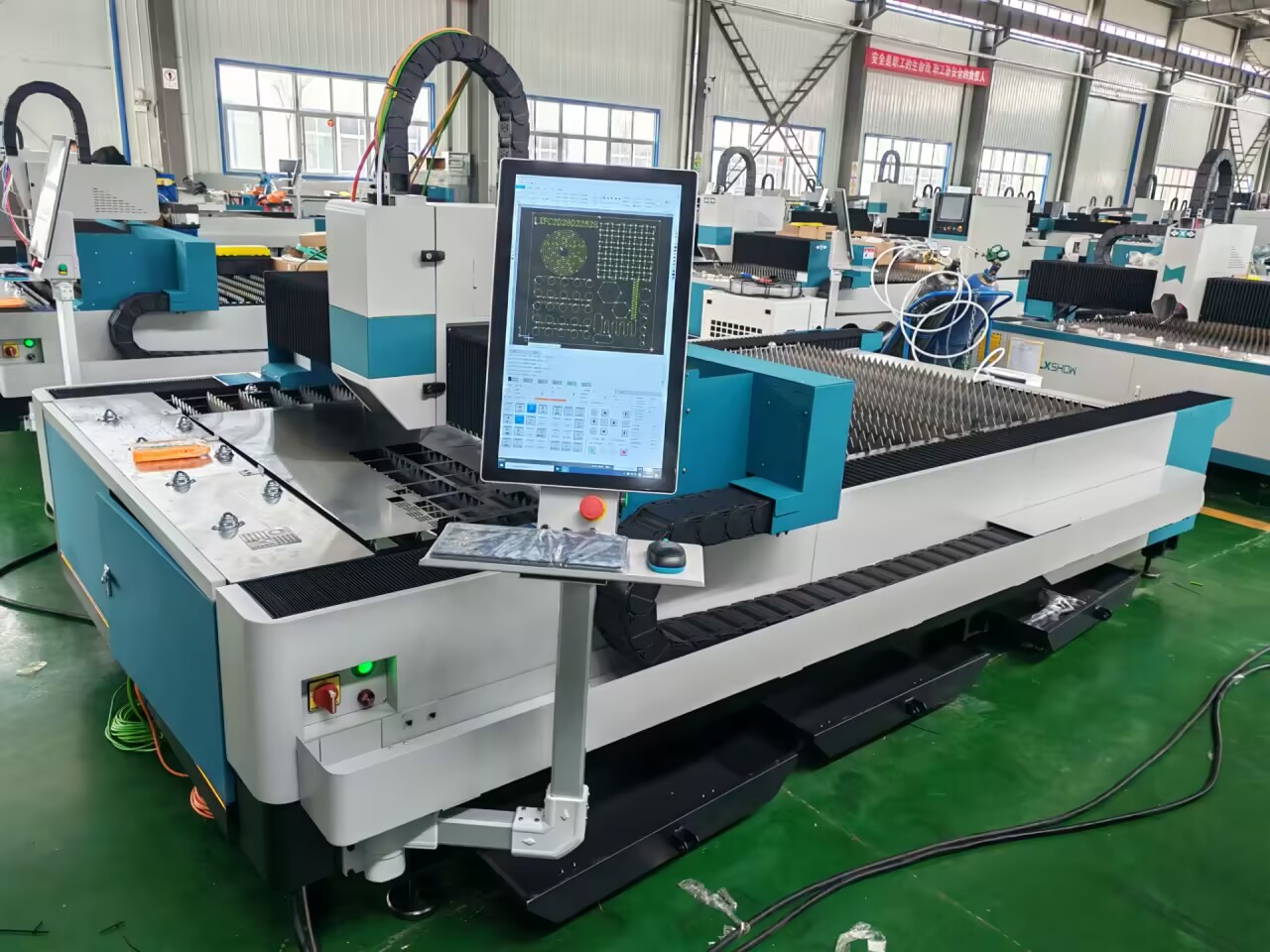 High-power fiber laser cutting machine cutting steel plate with sparks